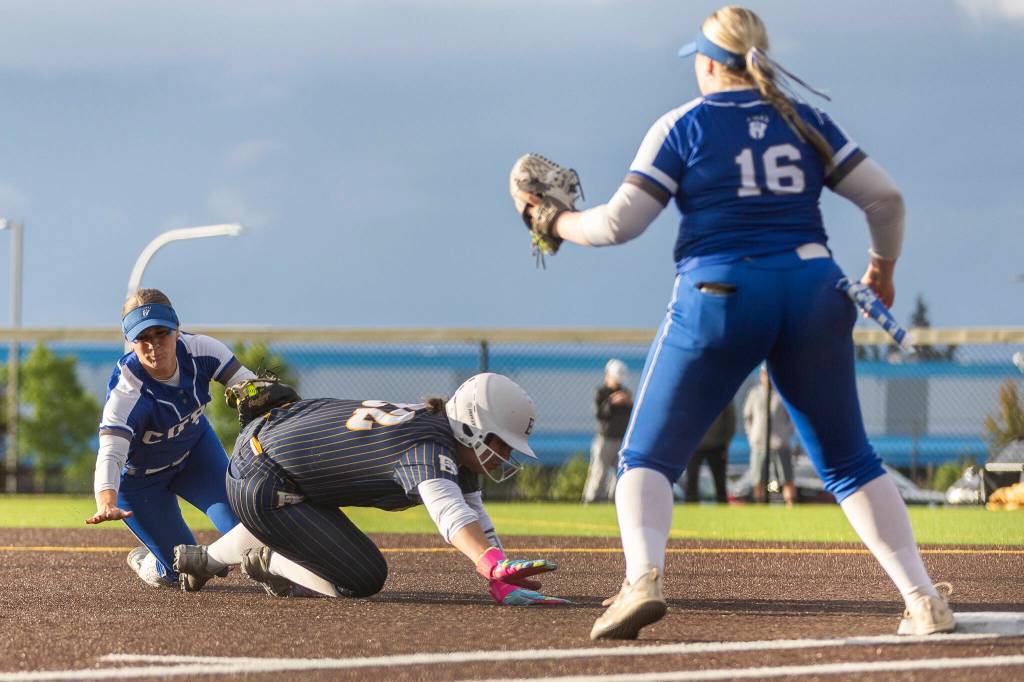 Everetts Alyssa Iverson is tagged while diving back to first base during the 3A district championship game against Sedro-Woolley on Thursday, May 14, 2026 in Everett, Washington. (Olivia Vanni / The Herald)