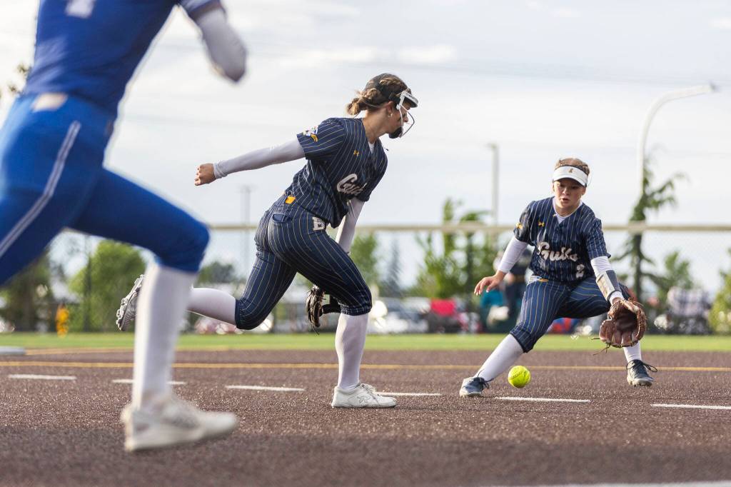 A hit falls between Everetts Anna Luscher and Everetts Kaitlyn Kelley during the 3A district championship game against Sedro-Woolley on Thursday, May 14, 2026 in Everett, Washington. (Olivia Vanni / The Herald)