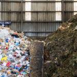 A wall divides recyclables from yard and food waste inside a tipping building at Cedar Grove on Thursday, May 14, 2026 in Everett, Washington. (Olivia Vanni / The Herald)