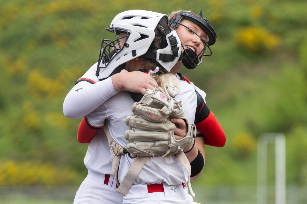 Snohomishs Abby Edwards hugs teammate Rozlynn Girard during the 3A district loser-out game against Shorewood on Thursday, May 14, 2026 in Everett, Washington. (Olivia Vanni / The Herald)