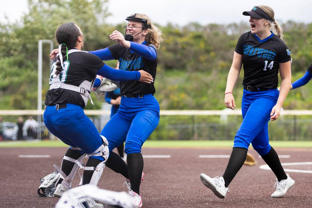 Shorewoods Ellie Van Horn runs to hug teammates Shorewoods Lillian Perreault after beating Snohomish in the 3A district loser-out game on Thursday, May 14, 2026 in Everett, Washington. (Olivia Vanni / The Herald)