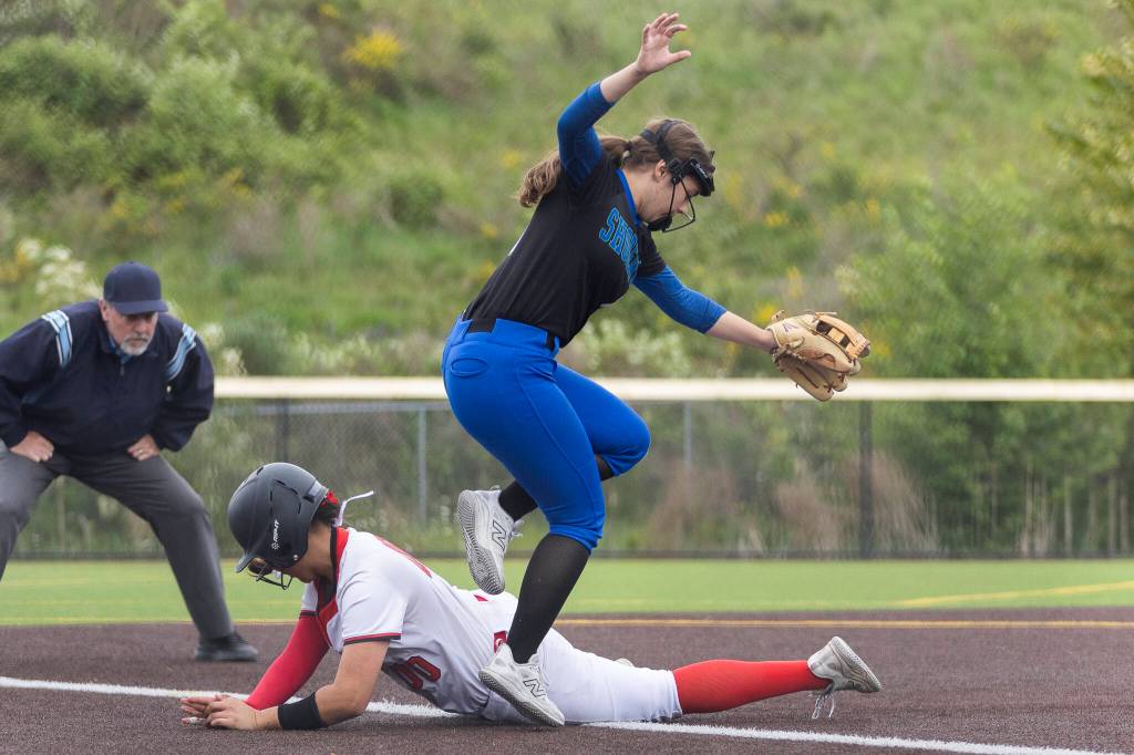 Snohomishs Amelie Lopez slides into third base during the 3A district loser-out game against Shorewood on Thursday, May 14, 2026 in Everett, Washington. (Olivia Vanni / The Herald)