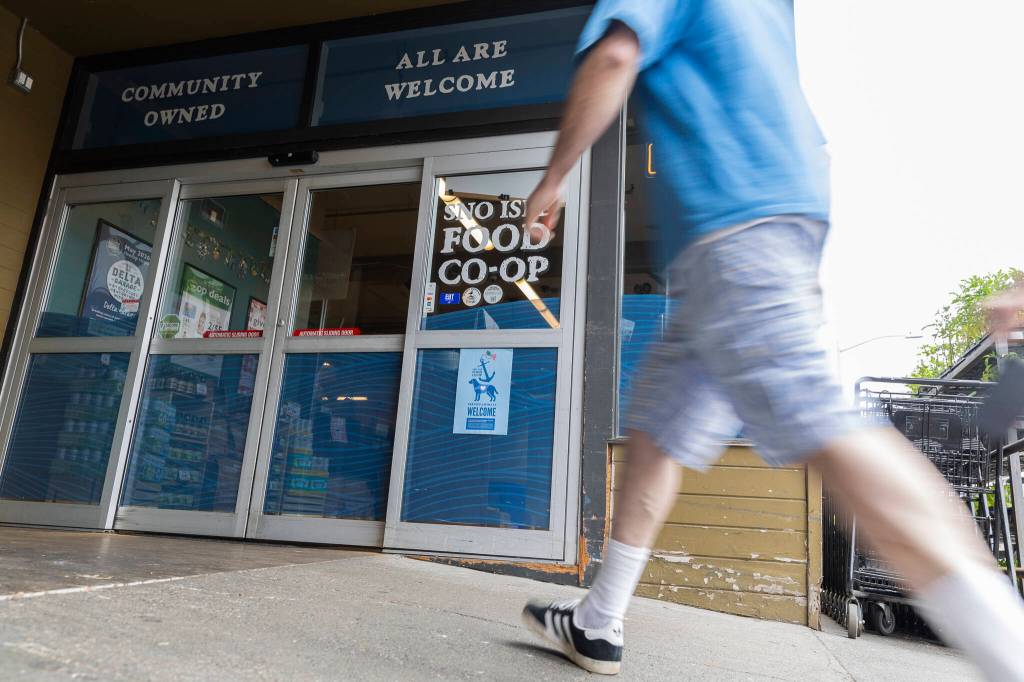 A customer walks in to the Sno-Isle Food Co-op on Wednesday in Everett. (Olivia Vanni / The Herald)