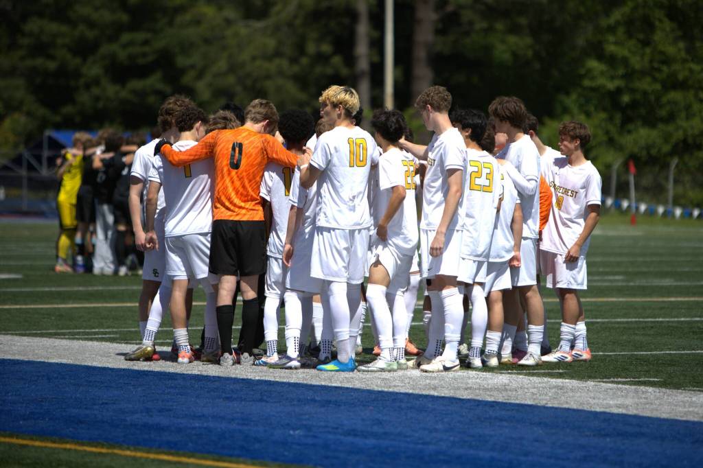 The Shorecrest boys soccer team huddles before the District 1 3A Tournament title game against Shorewood on Saturday, May 16, 2026 at Shoreline Stadium in Shoreline. (Qasim Ali / The Herald)