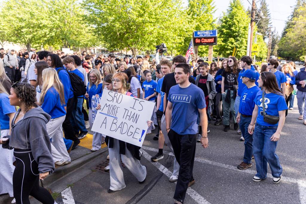 More than 200 students walk out of Bothell High School in protest of the school boards vote to not renew the contract for their school resource officer on Monday, May 18, 2026, in Bothell, Washington. (Olivia Vanni / The Herald)