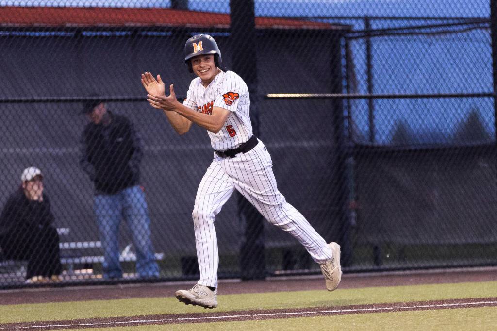 Monroes Joe Enrico reacts after scoring due to a balk by the Enumclaw pitcher with bases loaded to win the 3A state opening round loser-out game on Tuesday, May 19, 2026 in Monroe, Washington. (Olivia Vanni / The Herald)