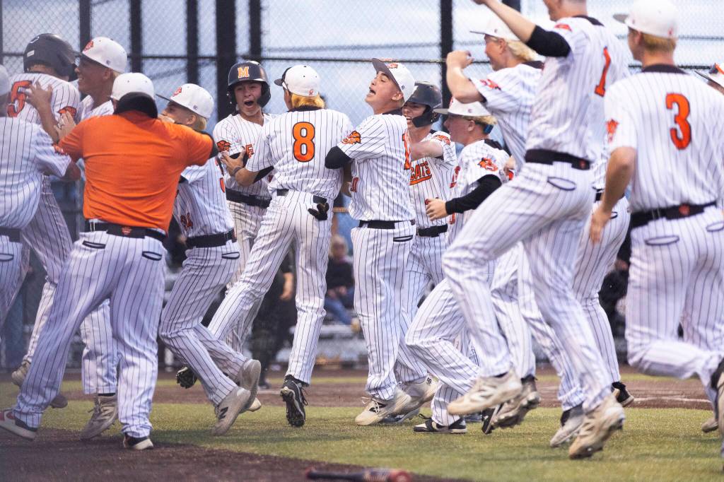 Monroe players react after beating Enumclaw in the 3A state opening round loser-out game on Tuesday, May 19, 2026 in Monroe, Washington. (Olivia Vanni / The Herald)
