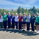 The top 16 individual placers at the 2026 WIAA 4A Girls State Championship that stuck around for the awards ceremony pose with their individual medals, including area placers: Jackson junior Chanyoung Park (2nd), Kamiak junior Sarah Dyer (t-4th), Kamiak freshman Noel Chang (t-6th) and Glacier Peak freshman Natalia Sanchez-Godinez (t-14th), at The Golf Club at Hawks Prairie in Lacey, Washington on May 20, 2026. (Joe Pohoryles / The Herald)