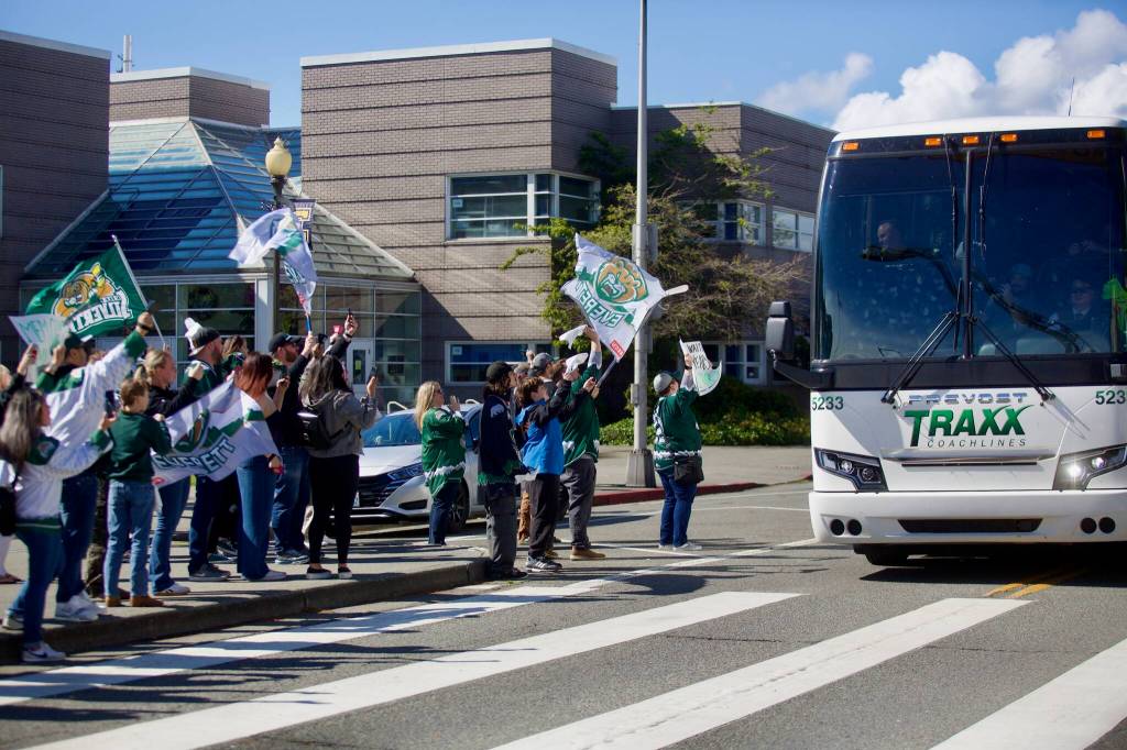 Silvertips fans greet the team bus upon its return to Everett on May 16 following the teams WHL Championship-clinching win against the Prince Albert Raiders the night before. (Joe Pohoryles / The Herald)