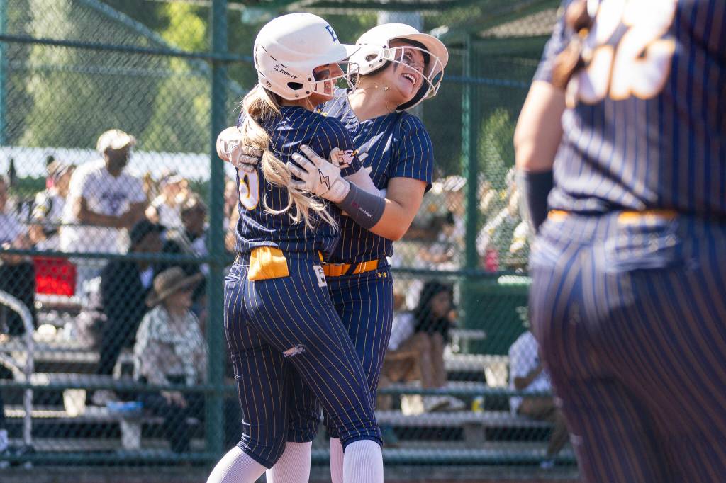 Everetts Mia Hoekendorf hugs teammate Haylie Oyler after scoring to tie up the game during the 3A state opening round loser-out game against Garfield on Friday, May 22, 2026 in Lacey, Washington. (Olivia Vanni / The Herald)