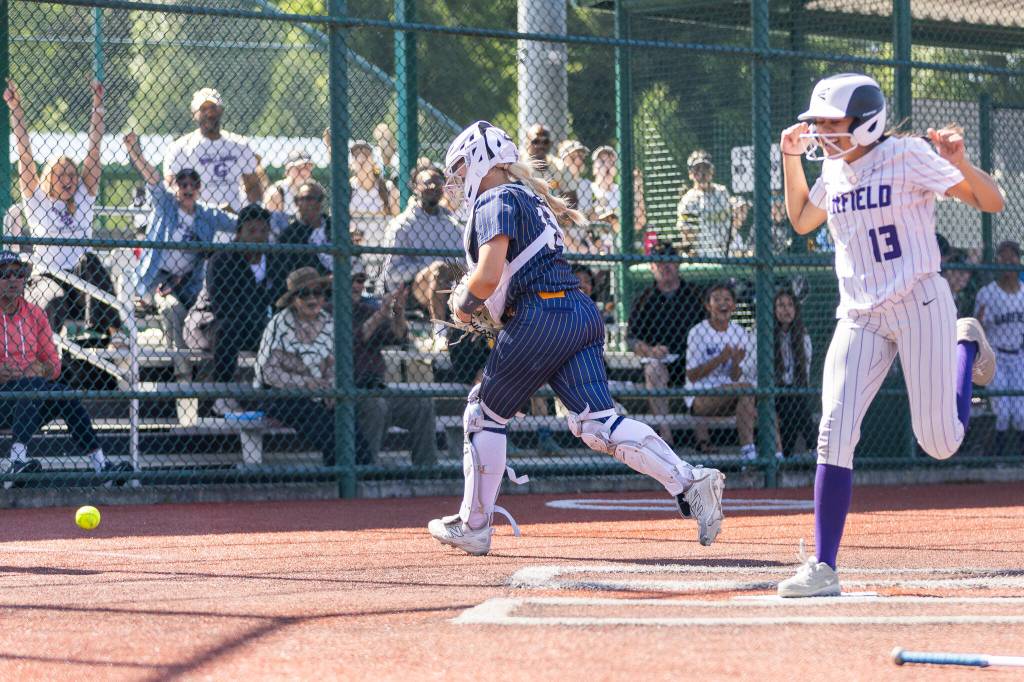A throw to home misses Everetts Haylie Oyler and the winning run for Garfield comes across the plate during the 3A state opening round loser-out game against Garfield on Friday, May 22, 2026 in Lacey, Washington. (Olivia Vanni / The Herald)