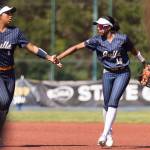 Everetts Akilah Shaw high fives teammate Everetts Ziarah Parker during the 3A state opening round loser-out game against Garfield on Friday, May 22, 2026 in Lacey, Washington. (Olivia Vanni / The Herald)