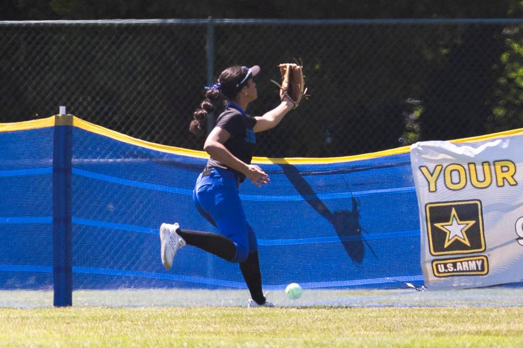 A ball hit by Sedro-Woolley goes over the back fence during the 3A state opening round loser-out game between Shorewood and Sedro-Woolley on Friday, May 22, 2026 in Lacey, Washington. (Olivia Vanni / The Herald)