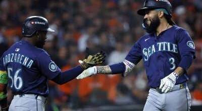 J.P. Crawford (3) of the Seattle Mariners has been a help to rookie Colt Emerson, who could potentially take over the shortstop position soon. (Getty Images / The Athletic)