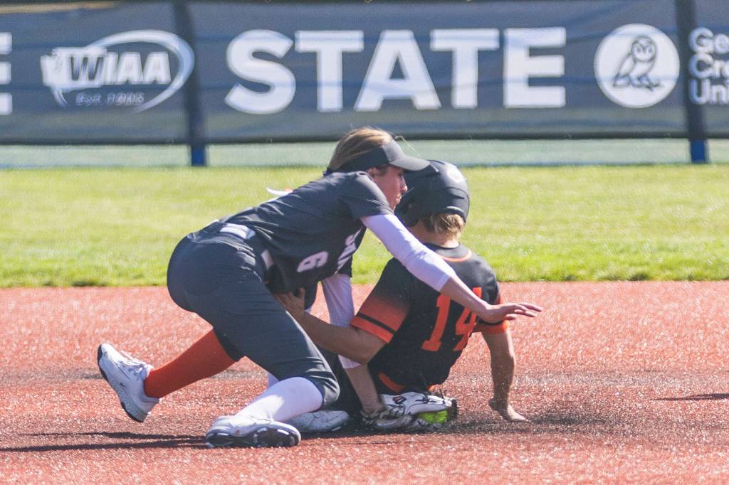 Stanwoods Jemma Lopez tags out a runner sliding into second base during the 3A state quarterfinal game against Kennewick on Friday, May 22, 2026 in Lacey, Washington. (Olivia Vanni / The Herald)