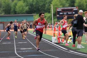 Jeshua Singletary of Kings competes in the 1,600-meter relay at the 2026 1A District 1-2 Championships at Granite Falls High School. (Photo courtesy of Donna Beard)