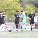 The Shorewood boys soccer team, including midfielder Isak Medhaug (6), embraces each other after beating Eastside Catholic 3-2 in a state quarterfinal game on Saturday, May 23, 2026 at Shoreline Stadium in Shoreline. (Qasim Ali / The Herald)