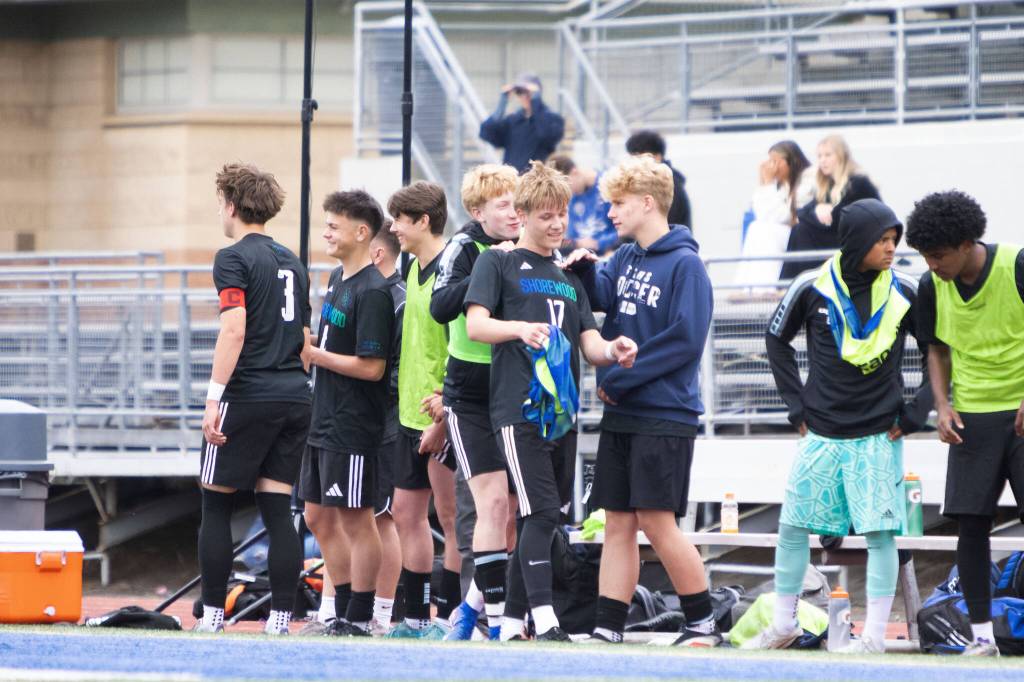Shorewoods Julian Shook (17) gets a pat on the back from teammates after scoring the game-winner in the 74th minute of a state quarterfinal game against Eastside Catholic on Saturday, May 23, 2026 at Shoreline Stadium in Shoreline. (Qasim Ali / The Herald)