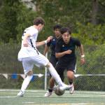 Shorewoods Ian Baxter tries to work past Eastside Catholics Jackson Leary during the first half of a state quarterfinal game on Saturday, May 23, 2026 at Shoreline Stadium in Shoreline. (Qasim Ali / The Herald)