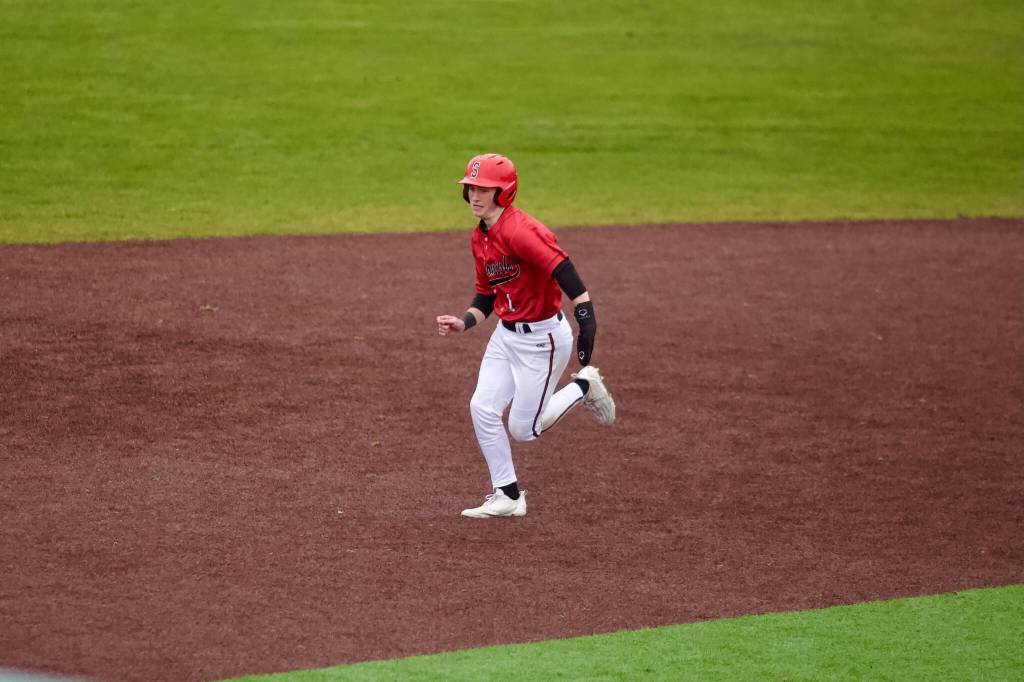 Snohomish senior Chase Clark runs between second and third base during the Panthers 6-5 win against Kamiak in their season-opener at Kamiak High School on March 11, 2026. (Joe Pohoryles / The Herald)