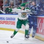 Silvertips forward Matias Vanhanen pins Saguenéens defenseman Alex Huang against the end boards, creating a turnover that led to Everetts fourth goal in its 5-3 win against Chicoutimi in the Memorial Cup round-robin at Prospera Place on May 23, 2026. (Photo courtesy Steve Dunsmoor / CHL)