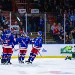 The Kitchener Rangers celebrate a goal as Silvertips defenseman Kayd Ruedig rises back to his feet during Kitcheners 6-2 win against Everett in the Memorial Cup round-robin at Prospera Place on May 25, 2026. (Photo courtesy Steve Dunsmoor / CHL)