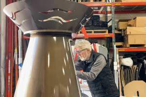 Doug Brown, a Boeing associate technical fellow BCA Engineering, working on the cauldron. Brown created the design and led the final assembly in Everett, Washington. (Provided photo)