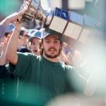 Silvertips forward Rylan Gould carries the Ed Chynoweth Cup through a crowd of fans in front of Everett High School on May 16, 2026 upon the teams return from its WHL Championship-clinching win against the Prince Albert Raiders the night before. (Joe Pohoryles / The Herald)