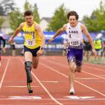 Arlingtons Ramon Little, left, and Lake Stevens Avery Couchette race in the boys ambulatory 400 M final during the WIAA State Track & Field Championships on Friday, May 29, 2026 in Tacoma, Washington. (Olivia Vanni / The Herald)