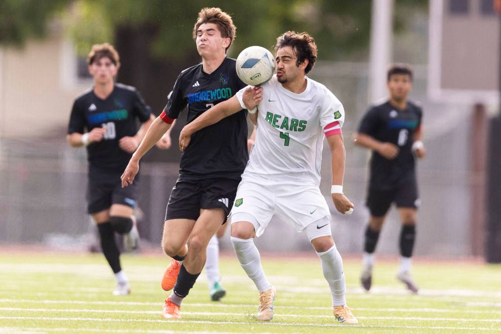 Shorewoods Daniel Bruno and Bishop Blanchets Roshan Russnak compete for the ball during the 3A state semifinal game on Friday, May 29, 2026 in Puyallup, Washington. (Olivia Vanni / The Herald)