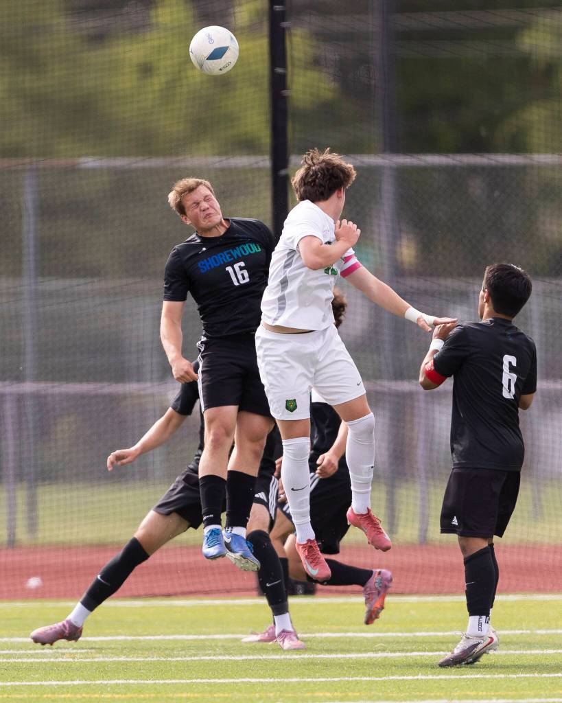Shorewoods Caleb Butler and Bishop Blanchets Jackson Farrell jump to head the ball during the 3A state semifinal game on Friday, May 29, 2026 in Puyallup, Washington. (Olivia Vanni / The Herald)