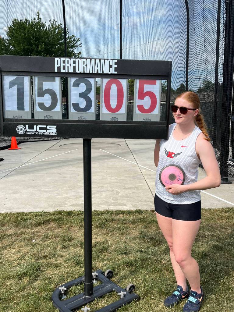 Kimberly Beard of King's High School stand next to her winning mark in the discus at the Class 1A/2B/1B state meet, which took place May 28-30, 2026 at Zaepfel Stadium in Yakima, Washington. (Photo courtesy of Donna Beard)