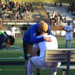 Shorewood boys soccer assistant coach Travis Bear consoles senior Kai Ayers after the 2026 class 3A boys soccer state championship game against Mercer Island on Saturday, May 30, 2026 at Sparks Stadium in Puyallup. (Qasim Ali / The Herald)
