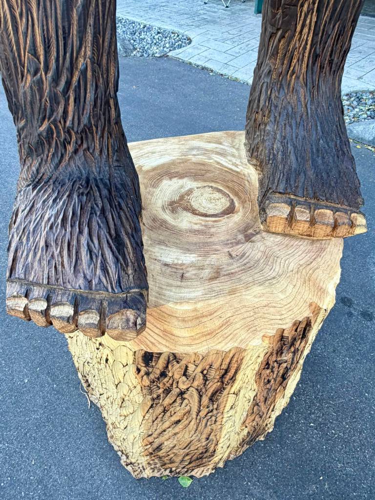 The big feet of a new 12-foot-tall carved Bigfoot nicknamed Cedar Squatchy in front of Squatchys gift shop in Oak Harbor near Deception Pass State Park. (Andrea Brown / The Herald)