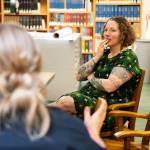 Lisa Labovitch, right, a history specialist at the Everett Public Library who helped research Charles Ed Rays background, speaks with Everett police officer Alisa Graetzer, left, in the Northwest Room of the Everett Public Library on May 22, 2026.