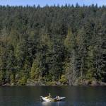 A person fishes on Pass Lake at Deception Pass State Park on Monday, March 2, 2026 in Anacortes, Washington. (Olivia Vanni / The Herald)