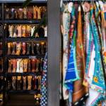 Boots line an entire wall inside FauxyFurr Vintage + Handmade on Wednesday, May 27, 2026 in Arlington, Washington. (Olivia Vanni / The Herald)