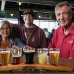 Scuttle Bannan, Phil Bannan Jr., and Phil Bannan at Scuttlebutt Brewing Restaurant and Pub Friday afternoon in Everett on July 2, 2021. (Kevin Clark / The Herald)