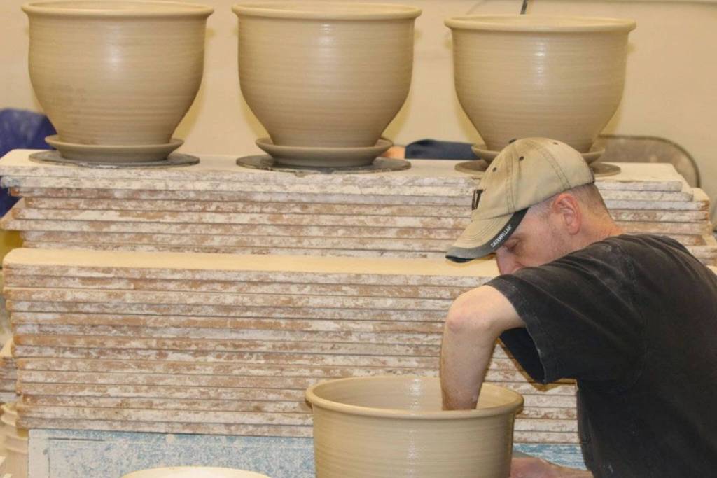 Ky Bruning throwing planters at Bruning Pottery in Snohomish.