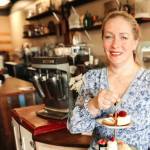 Heidi Mann at Heidis Sandwhichboard holding a three-tiered serving tray used for afternoon tea service in Snohomish, Washington. (Provided photo)