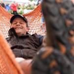 David Egnatz kicks back in one of his handmade hammocks during the Sorticulture gardening festival on Friday, June 5, 2026, in downtown Everett, Washington. (Will Geschke / The Herald)