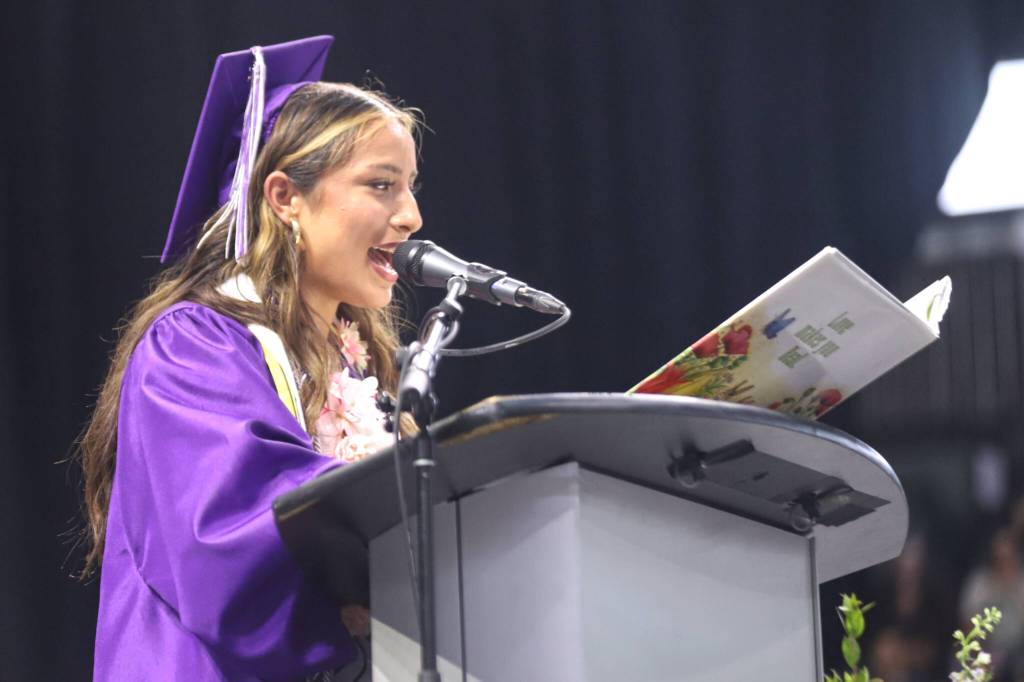 Mikayla Caro, Associated Student Body president for Kamiak High School, shares a passage from The Velveteen Rabbit during her speech at commencement for Kamiak High School graduates at the Angel of the Winds Arena on Friday in Everett.