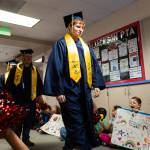 Caden Kuppler walks down the halls as students cheer him on during the grad walk ceremony at Jackson Elementary School on Tuesday, June 9, 2026, in Everett, Washington. (Will Geschke / The Herald)