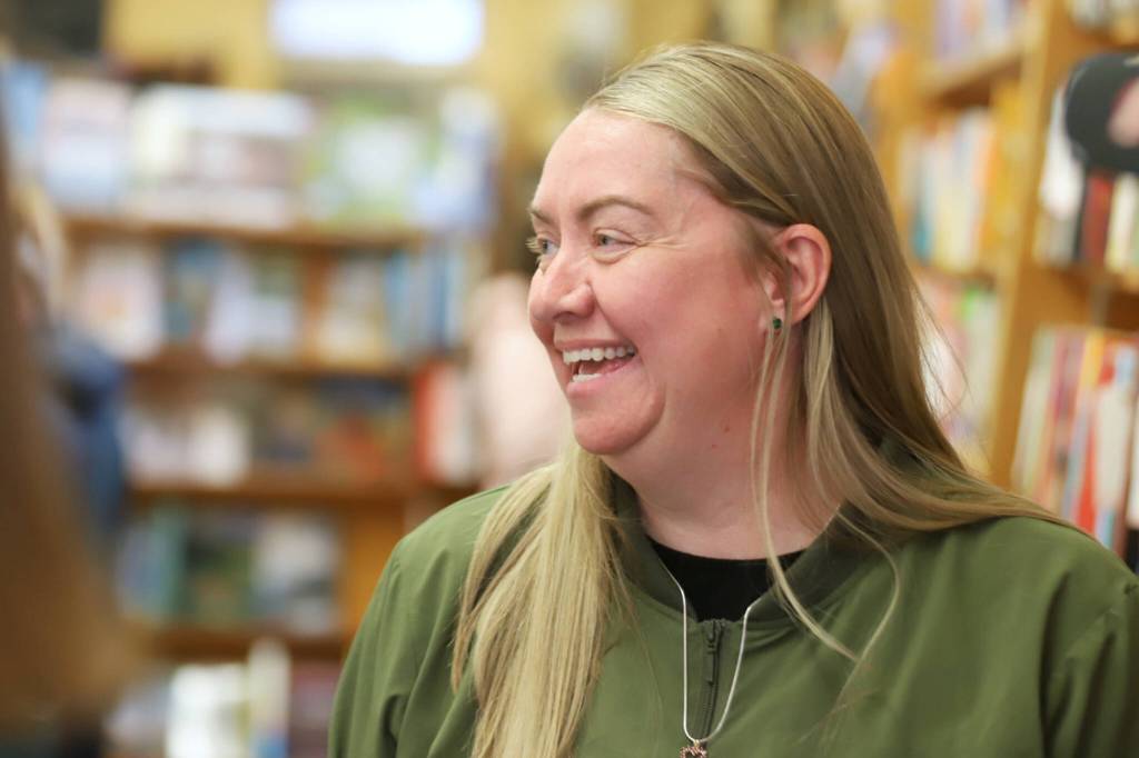 Melissa Foozer, an employee at Edmonds Bookshop, speaks during a launch for Edmonds Serves on Saturday, June 6, 2026, in Edmonds, Washington. Edmonds Bookshop is one of multiple businesses that displays Edmonds Serves posters. (Michael Henneke / The Herald)