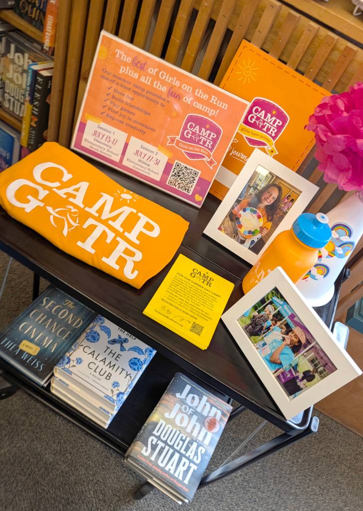 A display for the nonprofit Girls on the Run program in the Edmonds Bookshop during a launch for Edmonds Serves on Saturday in Edmonds. Melissa Foozer, an employee at the bookstore and a coach for the program said Edmonds Serves was “serendipitous” for her. (Michael Henneke / The Herald)