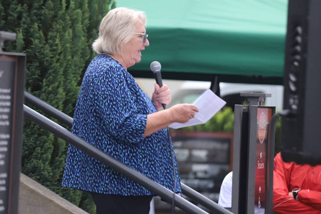 Kim Gorney, executive director of Washington Kids in Transition, speaks during a launch for Edmonds Serves on Saturday in Edmonds. (Michael Henneke / The Herald)