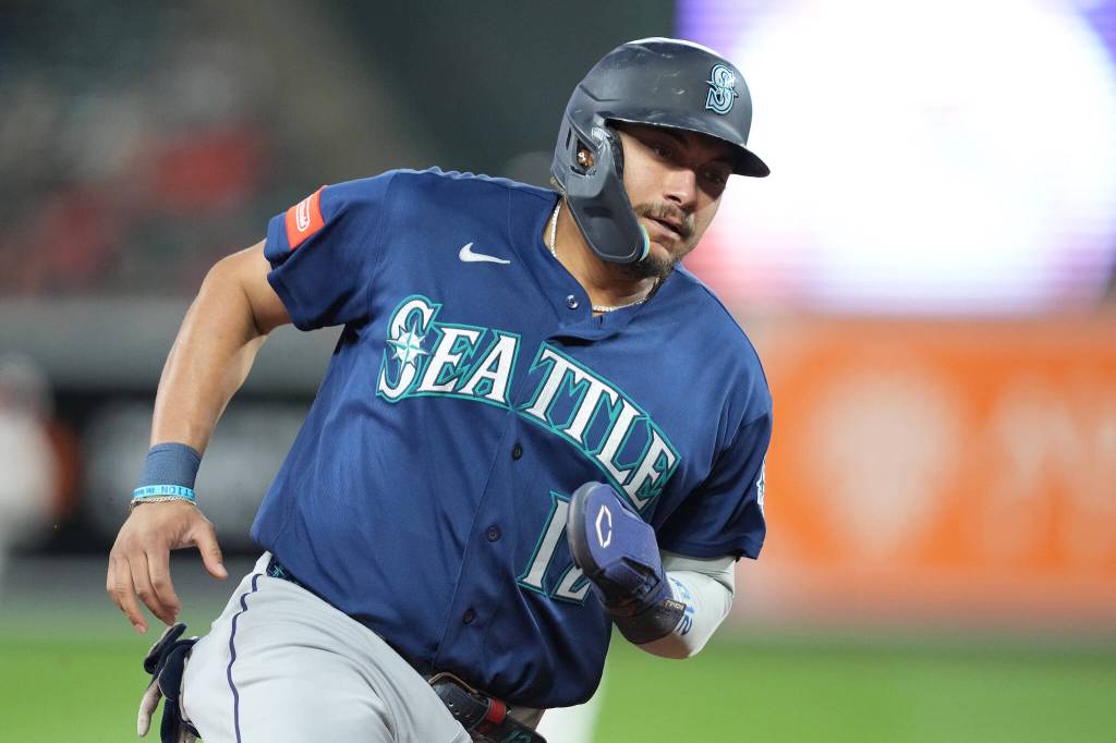 Josh Naylor (12) of the Seattle Mariners scores on a Randy Arozarena single in the eighth inning during the baseball game against the Baltimore Orioles at Camden Yards on June 8, 2026, in Baltimore, Maryland. (Mitchell Layton / Getty Images / Tribune News Services)