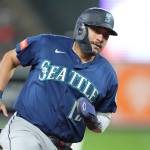 Josh Naylor (12) of the Seattle Mariners scores on a Randy Arozarena single in the eighth inning during the baseball game against the Baltimore Orioles at Camden Yards on Monday in Baltimore, Maryland. (Mitchell Layton / Getty Images / Tribune News Services)