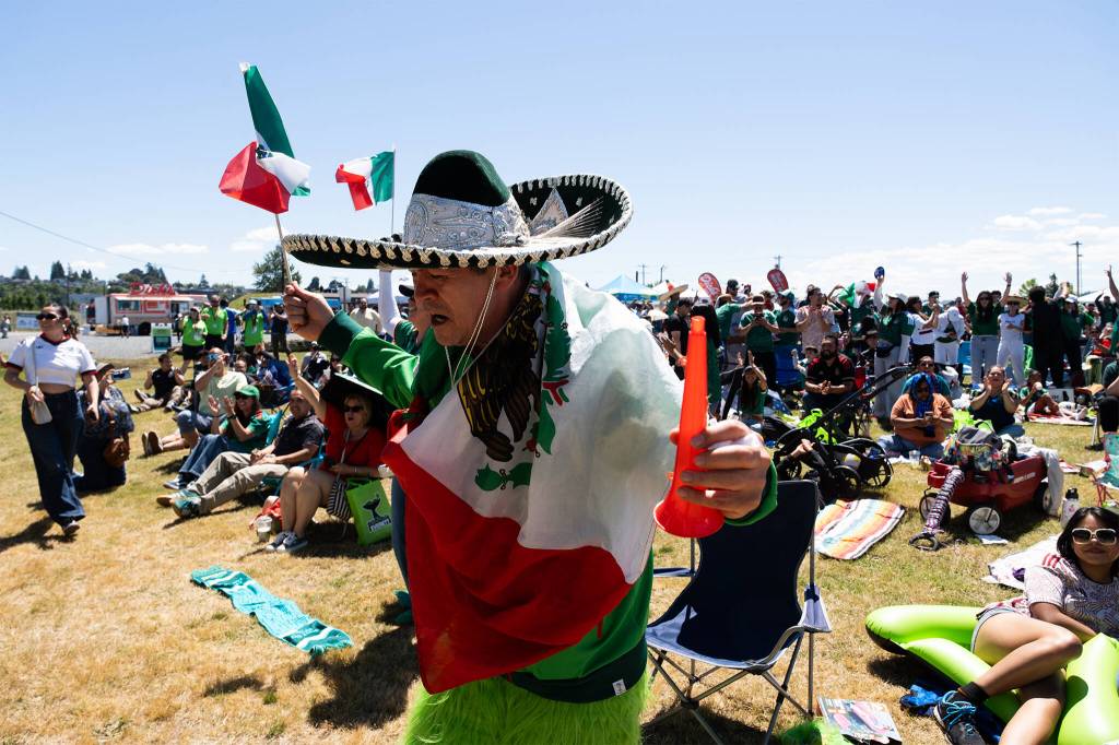 Mexico fans celebrate the opening goal of the 2026 FIFA World Cup on Thursday, June 11 at Boxcar Park in Everett, Washington. Mexico went on to win the game, 2-0. (Will Geschke / The Herald)