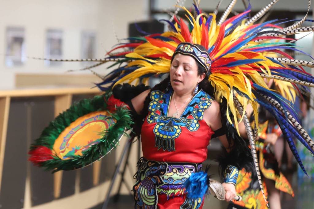 Adriana Maldonaldo, a member of the Yolihuani Aztec Dancers, performs during World Refugee Day at Edmonds Colleges Brier Hall on Friday, June 12, 2026, in Edmonds, Washington. (Michael Hennneke / The Herald)